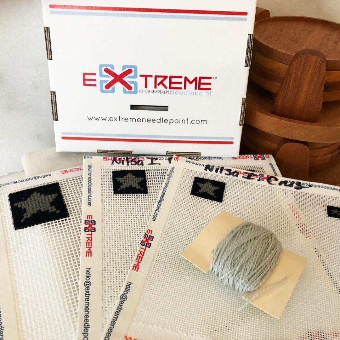 A box of extreme products with some papers and a hat