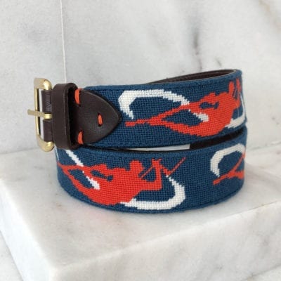 A blue and red belt with white swirls on it