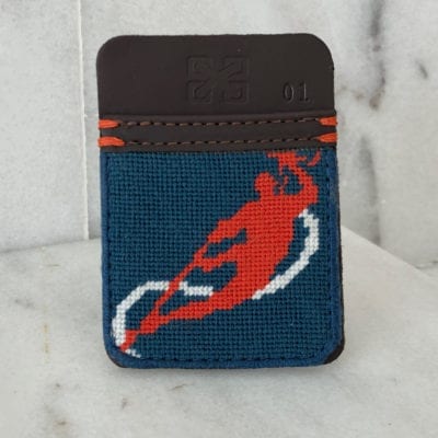 A card holder with a picture of a man playing frisbee.