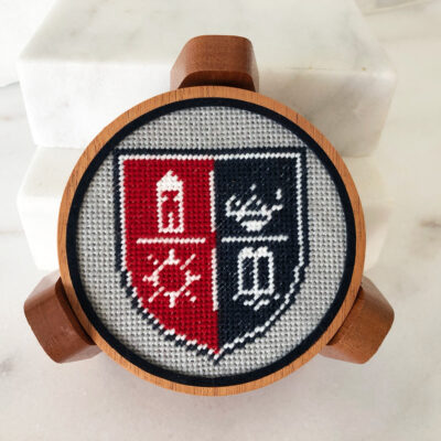 A cross stitch of the university crest.