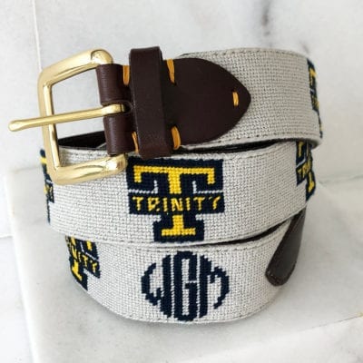 A white belt with the letters t, g and m on it.
