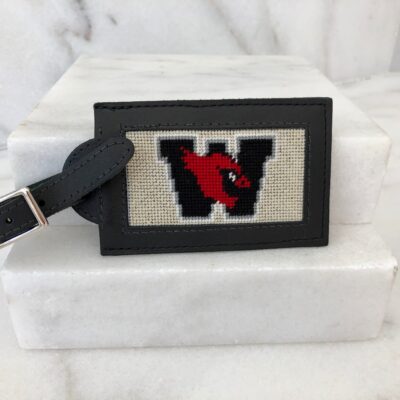 A black and white luggage tag with the letter w