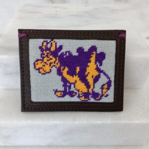 A purple and yellow cow is on the cover of a book.