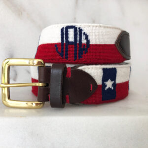 A red, white and blue belt with the letters jpb on it.