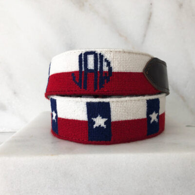 A red white and blue belt with an monogram on it