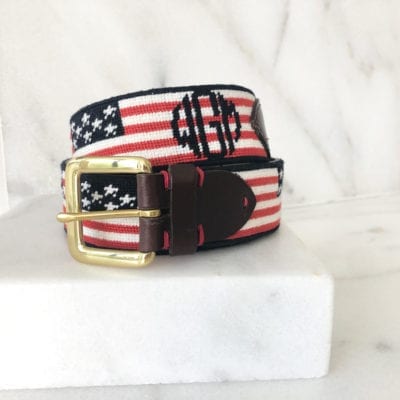 A red white and blue american flag belt with the letters m, h, l