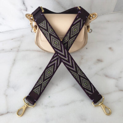 A strap that is attached to a purse.