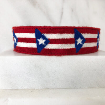 A red, white and blue bracelet with stars on it.