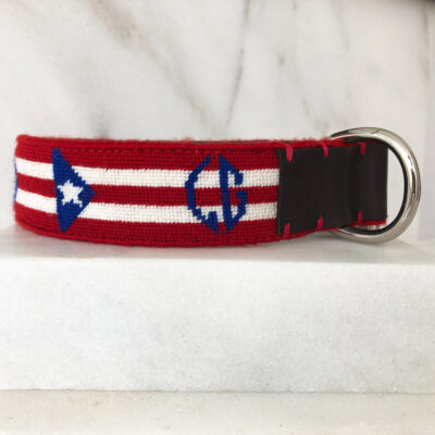 A red, white and blue belt with the letters c & g on it.