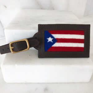 A leather luggage tag with the flag of puerto rico on it.