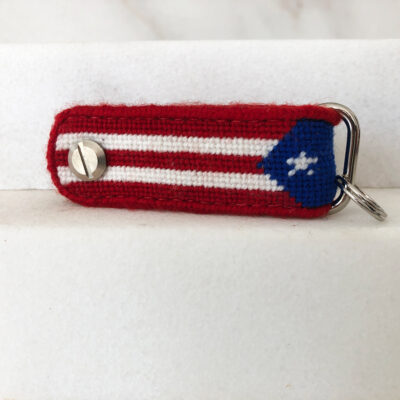 A red, white and blue key chain with a puerto rican flag on it.
