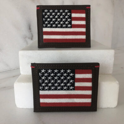 A picture of two american flags on top of white blocks.