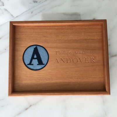 A wooden tray with the letter a on it.