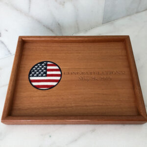 A wooden tray with an american flag on it.