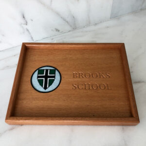 A wooden tray with the name of st. Patrick 's school on it