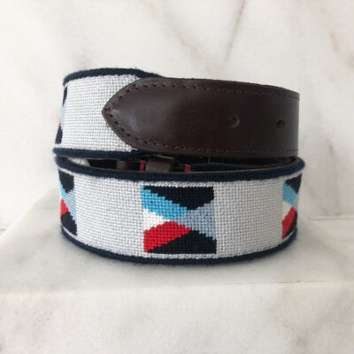 A white belt with red, blue and black squares on it.