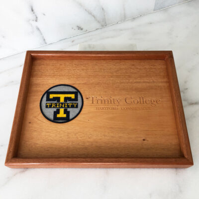 A wooden tray with the logo of temple university.