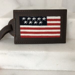 A leather luggage tag with an american flag design.