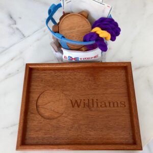 A wooden tray with a cookie cutter and some other items