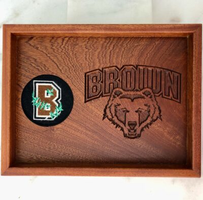 A wooden tray with a bear and the letter b