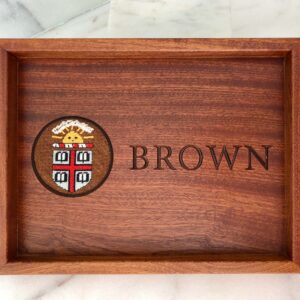 A wooden tray with the name brown on it.