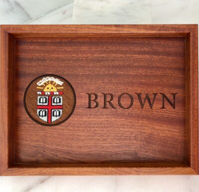A wooden tray with the name brown on it.